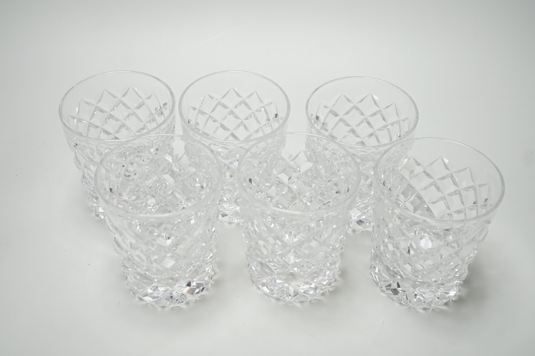 A set of six heavy hobnail cut glass whisky tumblers. 10cm high